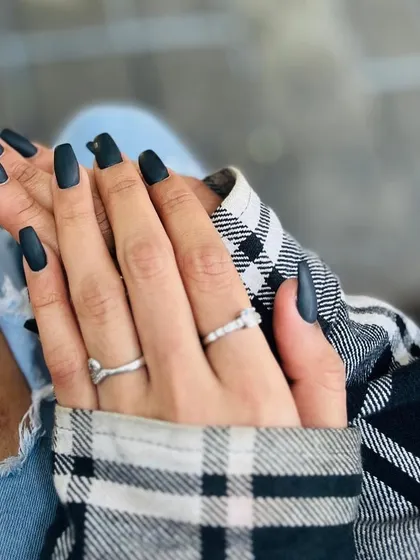 You can never go wrong with a bold, chic look. These long, square-shaped nails with a flawless matte black finish are perfect for making a sophisticated statement.