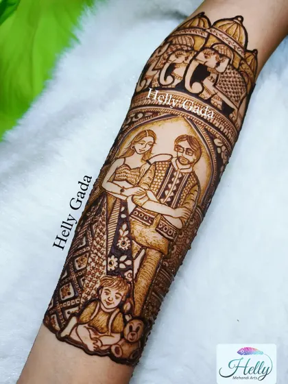 Here is the final, detailed look at the family portrait on the arm. The shading and line work bring the figures to life, framed by traditional elephant and architectural motifs.