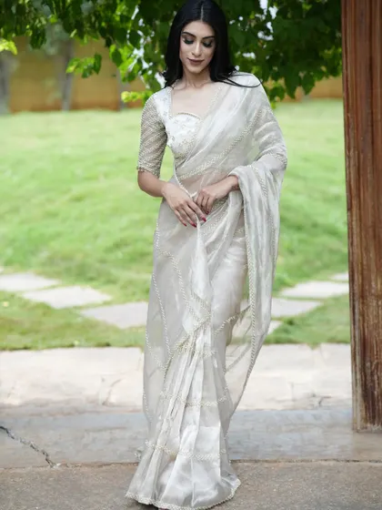 Another view of this sophisticated white saree, perfect for a daytime event or a minimalist bride.