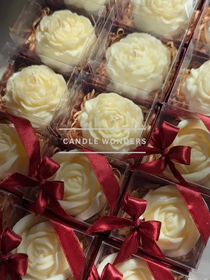 The finished peony and rose candles, individually boxed with a beautiful red ribbon.