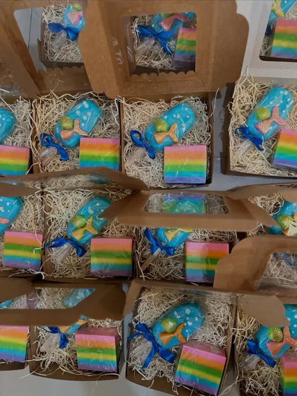 A magical combination of a mermaid popsicle soap and a vibrant rainbow soap, packed and ready for a birthday party.
