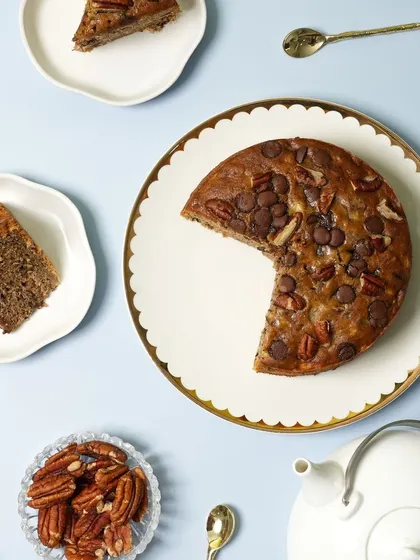 An overhead shot of my Banana Choco-Pecan Tea Cake. You can see how it's generously topped with pecans and milk chocolate callets before being baked to perfection.