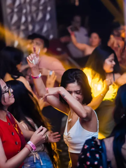 A guest completely lost in the music on the dance floor. This is the kind of uninhibited energy I aim to create with my high-energy house and pop sets.