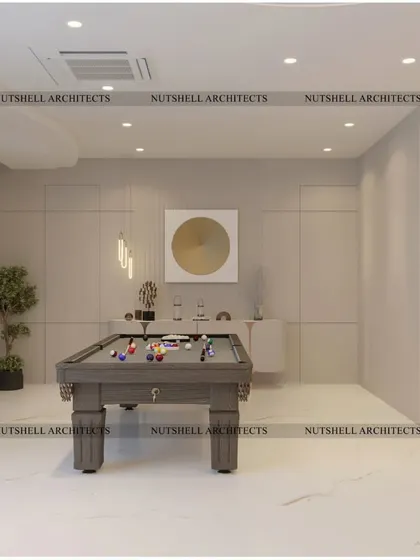 A simple yet refined billiards room, perfect for a quiet game. The space is kept bright and open with a neutral color palette, allowing the pool table to be the main focus.