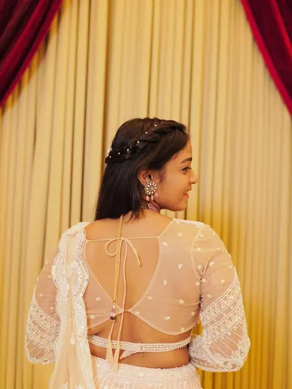 A beautiful back shot of the client, showing her hairstyle and the back design of the blouse.
