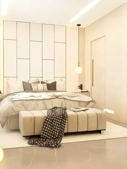 Another angle of the white bedroom, showing the clean lines and minimalist approach to the design.