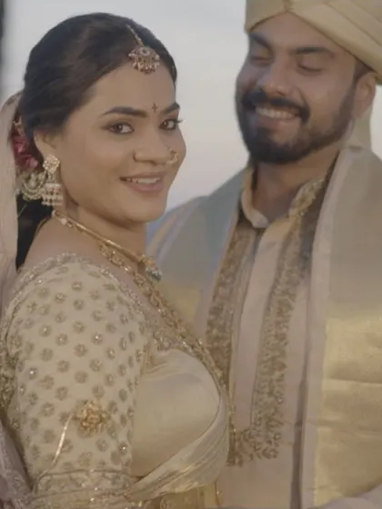 The classic Telugu bride, wrapped in tradition and elegance. This look captures the heritage and love of the occasion, featuring a radiant smile and the sacred Pelli bottu.