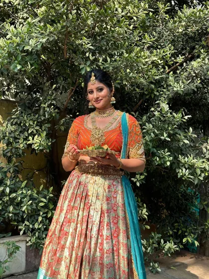 Full-length view of the Ugadi look, showing the complete half-saree draping and styling.