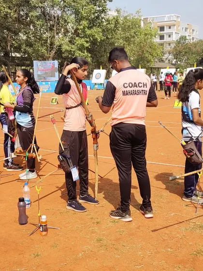 As the Maharashtra team coach, I'm seen here advising a student during the national competition in Vijayawada.