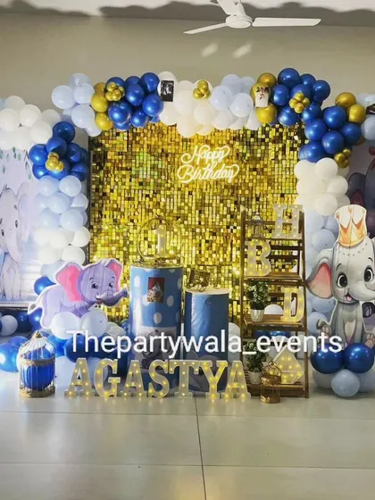 A baby elephant theme with a gold shimmer backdrop, adding a touch of sparkle to the celebration.