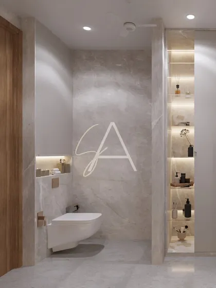 A clear view of the toilet area, which features a wall-mounted commode to save space and create a clean look. The subtle lighting in the niche adds a soft, ambient glow.