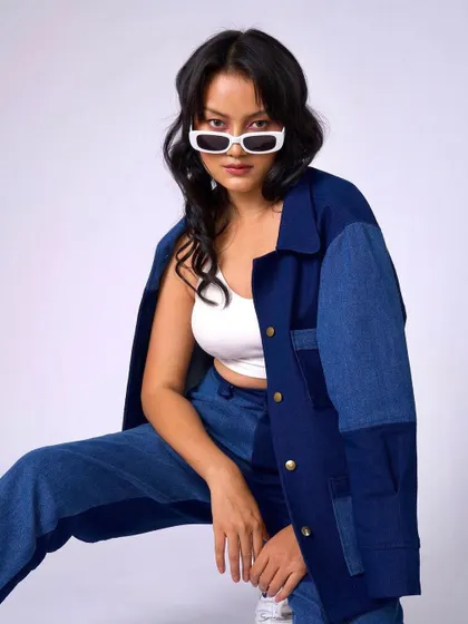 A final shot of the denim look, proving that simple, clean makeup is the perfect complement to a strong fashion statement.