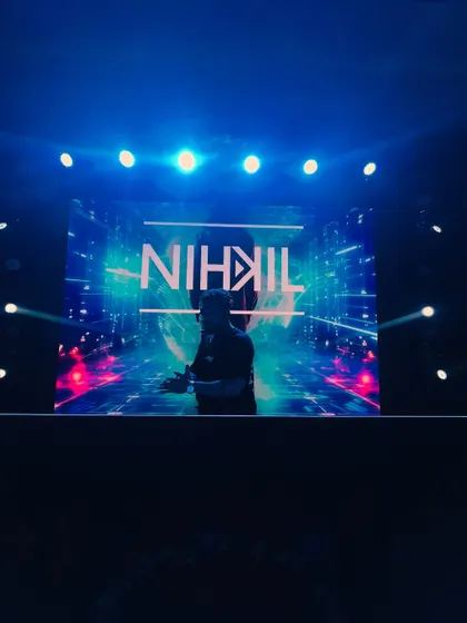 My custom visuals on the big screen behind me. I work to create a cohesive audio-visual show that represents my brand and energy.