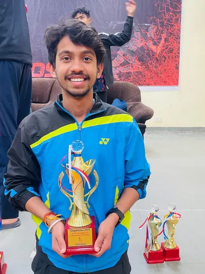 And this is the 'after'. The smile of a winner, holding trophies that represent countless hours of hard work and training. We celebrate every victory with our players.