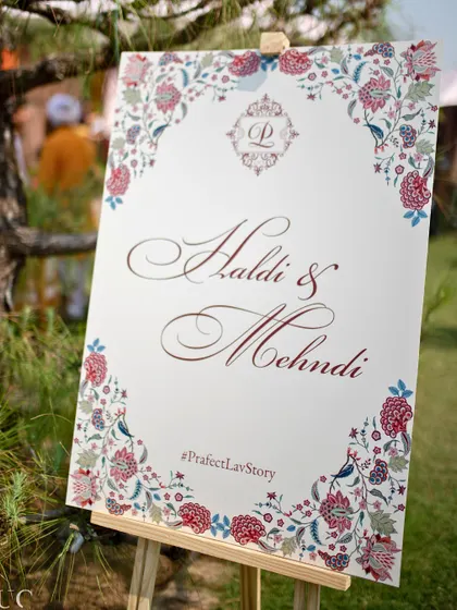 The official welcome signage for the Haldi and Mehendi, featuring the couple's wedding hashtag.