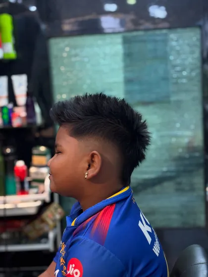 Another angle of the kids' mohawk, showing the clean fade on the sides.