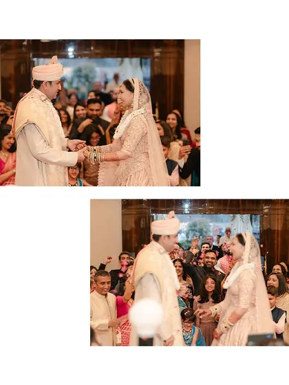 The exchange of garlands, a key moment in a Hindu wedding. We focus on the couple's expressions and the joy of the crowd.