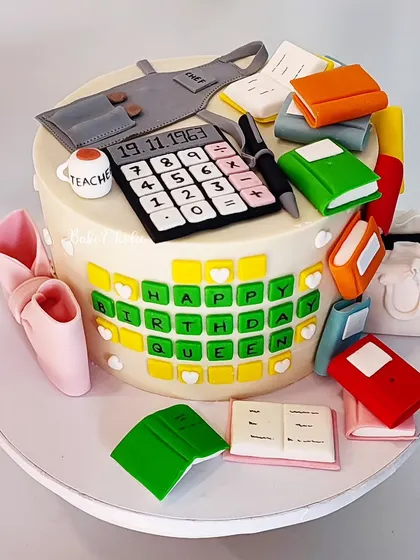 This was a highly detailed custom cake for a mom's birthday, featuring all her favorite things: Wordle, books, cooking, shopping, and more. Every element is handcrafted and edible.