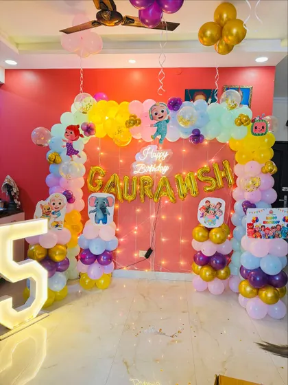 The full view of the colorful Cocomelon birthday party setup.