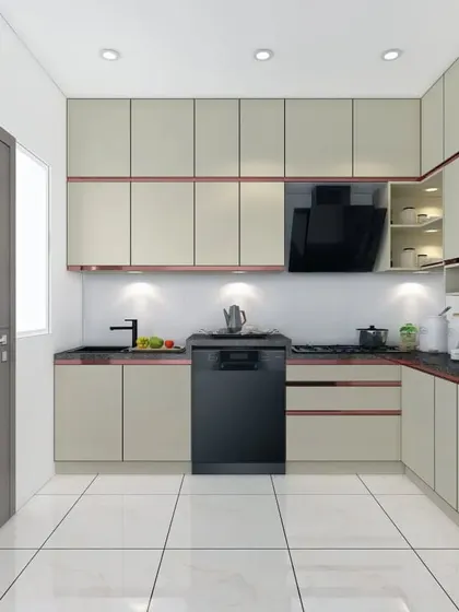 A spacious L-shaped kitchen with cream-colored cabinets and rose gold trim. The layout includes a dedicated space for a dishwasher, ensuring all modern conveniences are accounted for.