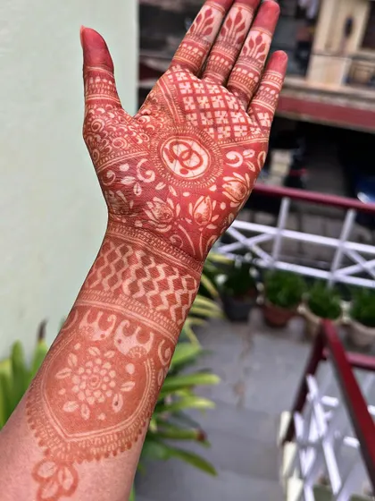 This is the result of an 8-hour stain. The color is a beautiful, deep reddish-brown, showing the quality of the henna paste. Patience and good aftercare really pay off.