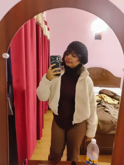 A duplicate of my cozy winter outfit selfie. Layering is key for staying warm and stylish in colder weather.