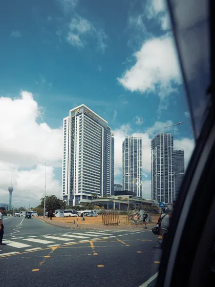 A view of the Colombo cityscape from a moving car. I love capturing these "in-between" moments of travel, as they often show the city from a unique and dynamic perspective.