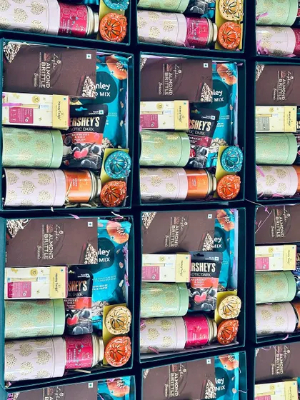 A grid-like view of the assembled Diwali hampers, ready for the final step of packaging and delivery.