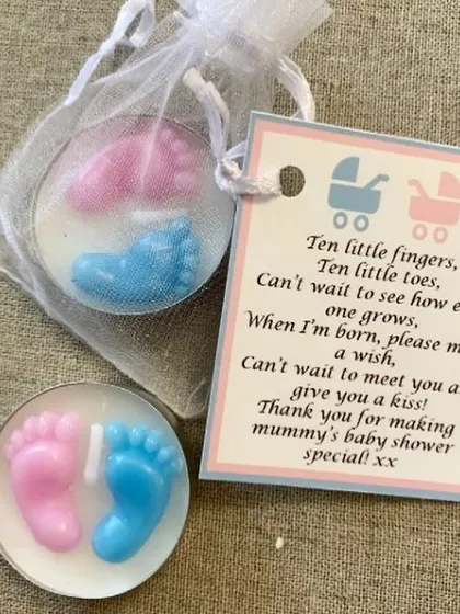These tealight candles with pink and blue baby feet are a super cute and affordable favor. They come packaged in an organza bag with a personalized poem.