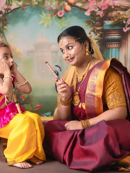 A playful interaction between mother and child. I encourage these moments to capture the fun and mischievous spirit of little Krishna.