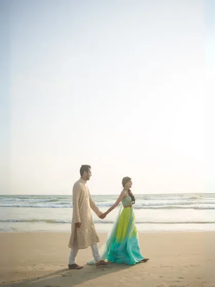A beautiful composition of the couple walking along the shoreline. This image, also used for our award-winning photographer promotions, highlights our skill in creating cinematic beach portraits.