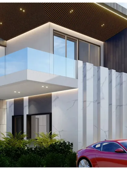 This minimal grand villa uses a palette of white marble, dark wood, and glass. The design emphasizes verticality and clean lines, with features like a glass balcony and subtle cove lighting.