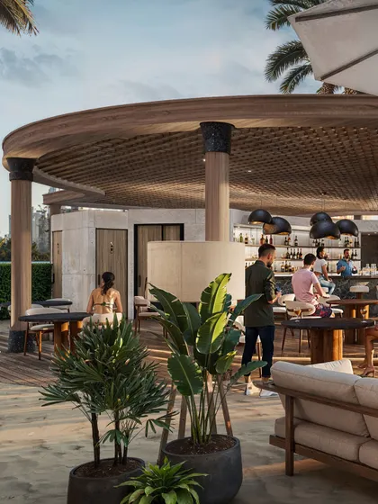 A view of the circular bar at the Fairmont beach club. This rendering focuses on the architectural details of the bar and the surrounding social interactions.