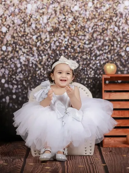 This full-length shot showcases the beautiful tutu dress and the complete vintage-glam setup, perfect for a special milestone or just-because photoshoot.