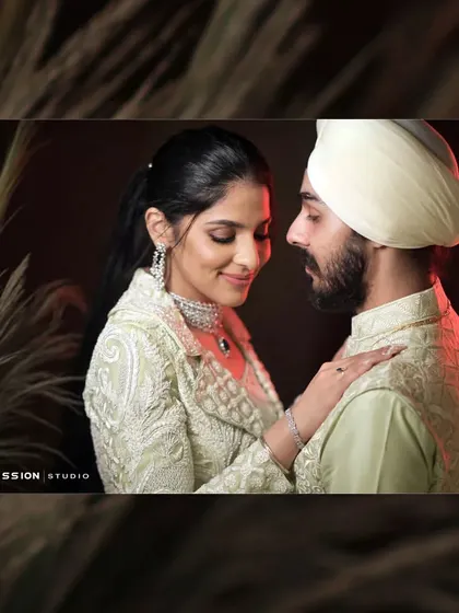 A beautiful portrait of a Sikh couple. The soft lighting and their gentle interaction create a feeling of romance and serenity.