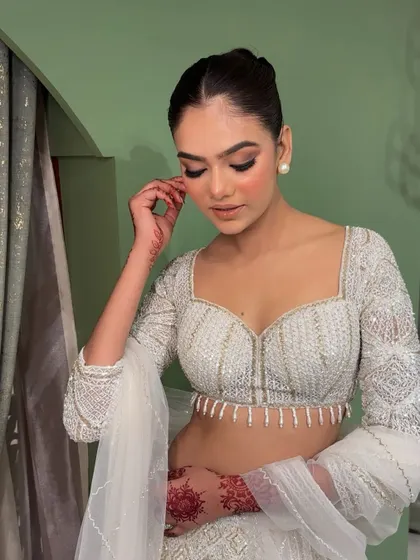 A candid moment showing the soft, blended eyeshadow and radiant skin. This is a versatile look that photographs beautifully.