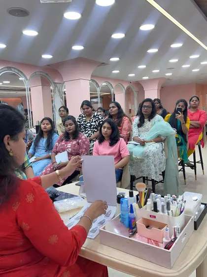A trainer explaining the different tools and products used in the nail technician course.