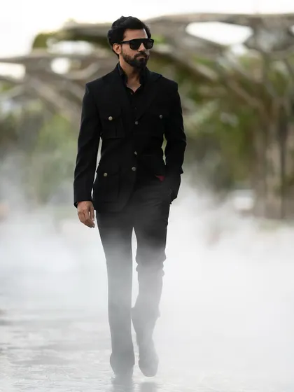 The Viaggio Blazer's unique design stands out, even in a monochromatic outfit.