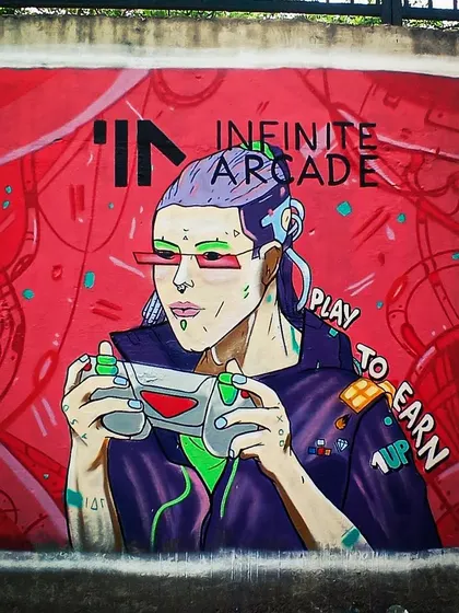 This is the final mural for the online gaming platform, Infinite Arcade. The artwork features a futuristic gamer character, bringing the digital world of web3 and blockchain gaming to a physical wall.
