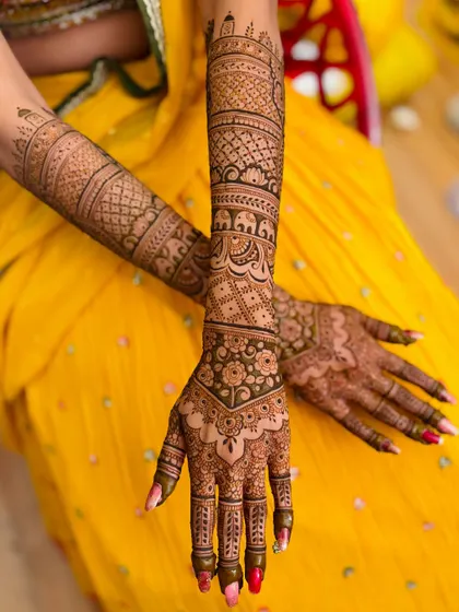 A beautiful bridal mehendi with a mix of traditional patterns. The design on the back of the hands is just as intricate as the front.