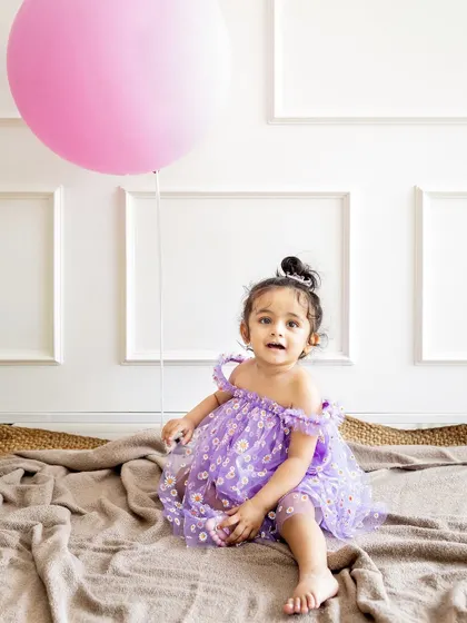A simple prop like a big pink balloon can bring so much wonder and joy to a toddler photoshoot. These shots are full of curiosity and fun.