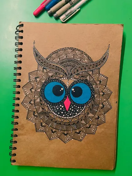 A detailed owl mandala on brown paper, created as part of a 30-day art challenge.