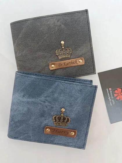 A side-by-side comparison of the personalized denim wallets in both grey and blue color options.
