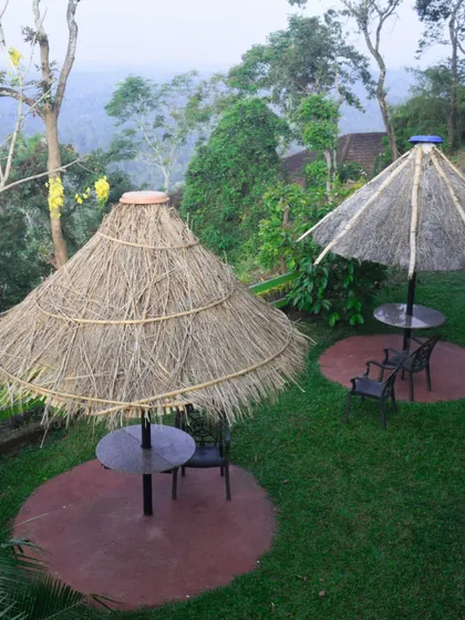 A peaceful corner at one of our partner resorts in Coorg, offering a quiet space for team members to relax and reflect with a view of the lush green valley.