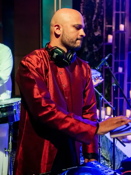 Focused on the mix. Ensuring a smooth flow of music is key to keeping the energy up all night long.