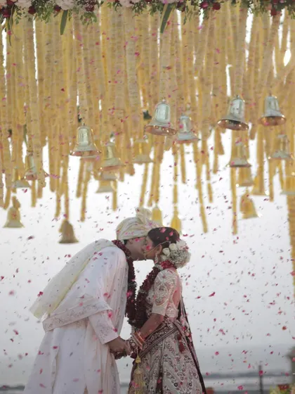 A kiss to seal their forever promise, under a canopy of hanging floral bells. We love incorporating unique decor elements that add a personal and symbolic touch to your ceremony.