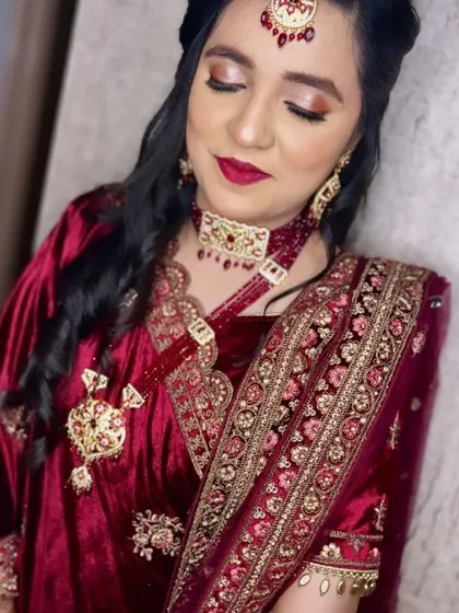 A still image of the glam party makeup, showing the smooth application and rich colours. The client is wearing a beautiful maroon velvet outfit, and the makeup enhances her features without feeling heavy, which is key to my approach.
