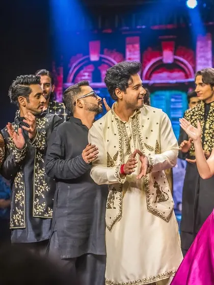 Sharing a moment of applause with the showstopper and models on the runway. The fusion of fashion and our live music was a magical experience.