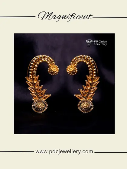A magnificent pair of traditional gold earrings. The intricate design and craftsmanship make these a stunning piece of heritage jewellery.