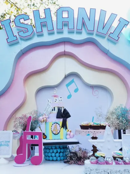 Another angle of the stunning music-themed dessert table, highlighting the intricate details of the cake and the surrounding decor that made Ishanvi's 4th birthday so special.